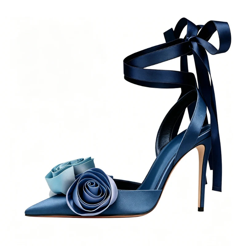 Blue satin stiletto sandals with gradient rose embellishments and ankle tie.