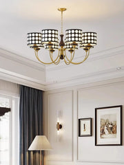 A retro-inspired polka dot chandelier with a minimalist design, hanging in a modern living room.