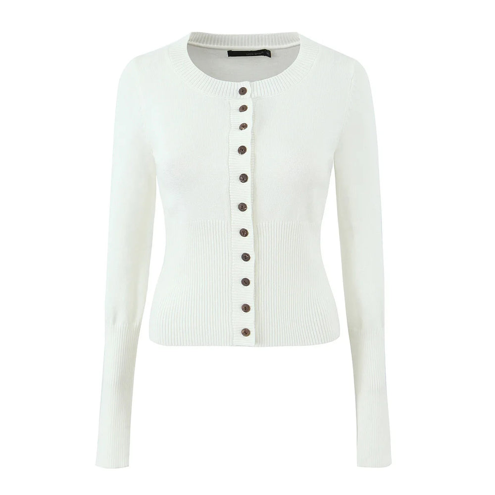 White cardigan with brown buttons on a white background