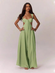 Woman wearing a green jumpsuit on a white background