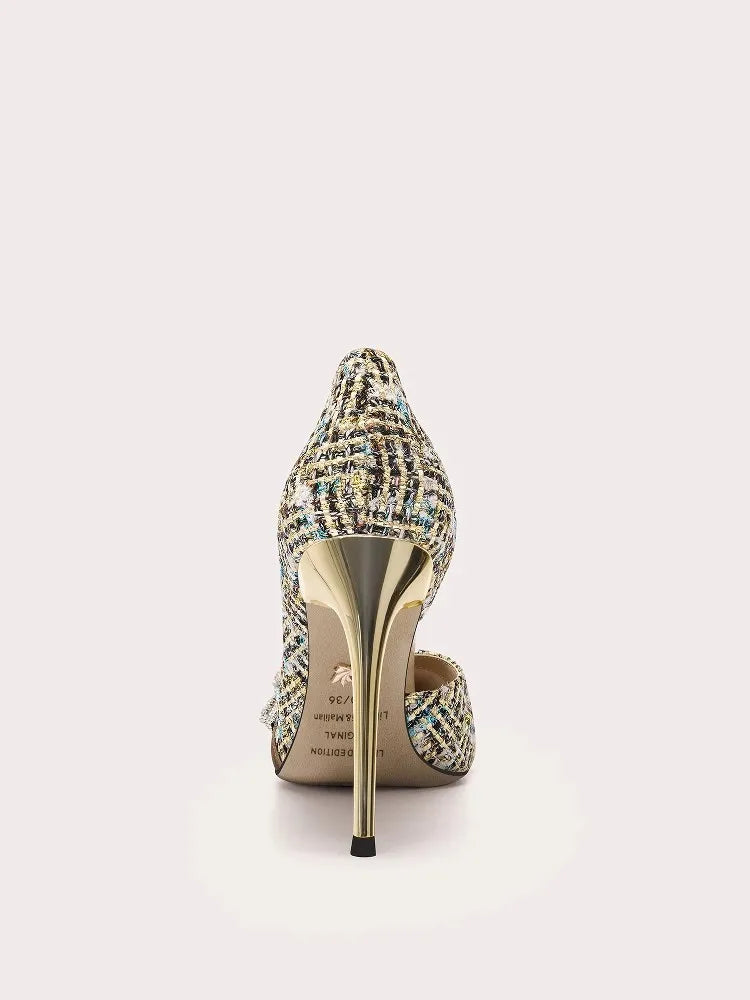 High-heeled shoe with intricate design on a white background