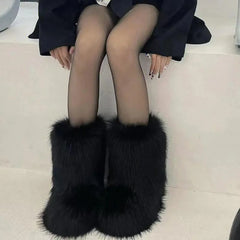 Woman wearing Fluffy Faux Fox Fur Winter Boots from Golden Atelier, showcasing the full boot and fur details.