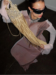 Model wearing sheer mesh maxi dress with bell sleeves and abstract print