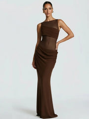 Woman wearing a brown one-shoulder evening gown on a white background