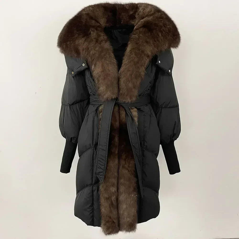Black winter coat with brown fur trim on a white background