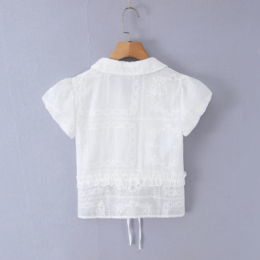 Back view of white embroidered puff sleeve crop top