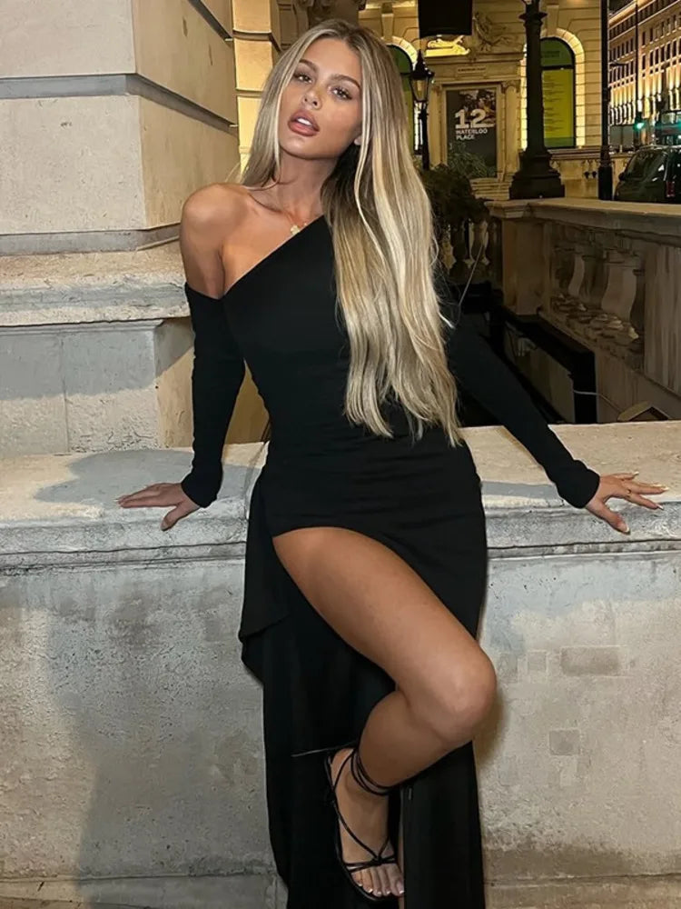 Black asymmetric evening dress with a high slit and bodycon fit