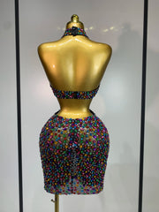 Back view of halter neck rhinestone mini dress with cut-out details