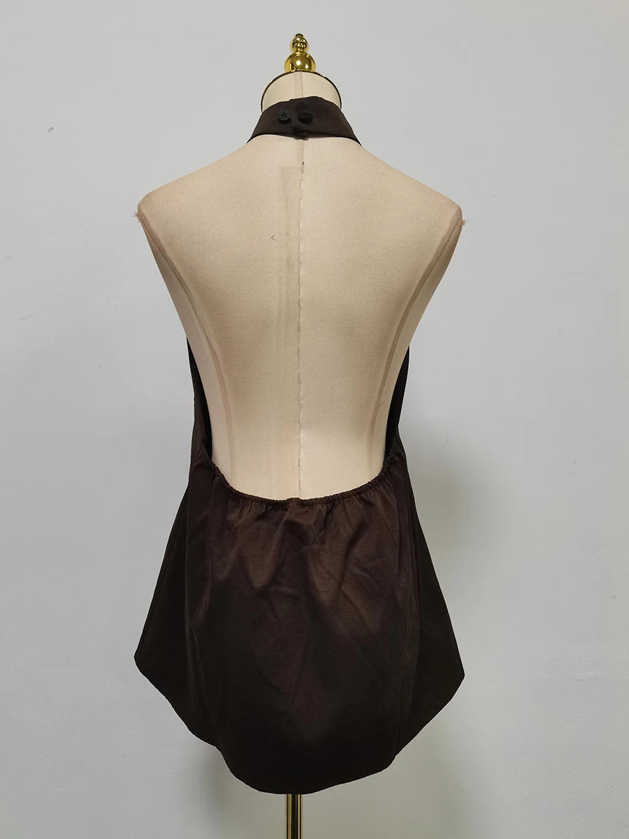 Mannequin wearing a brown skirt on a plain background