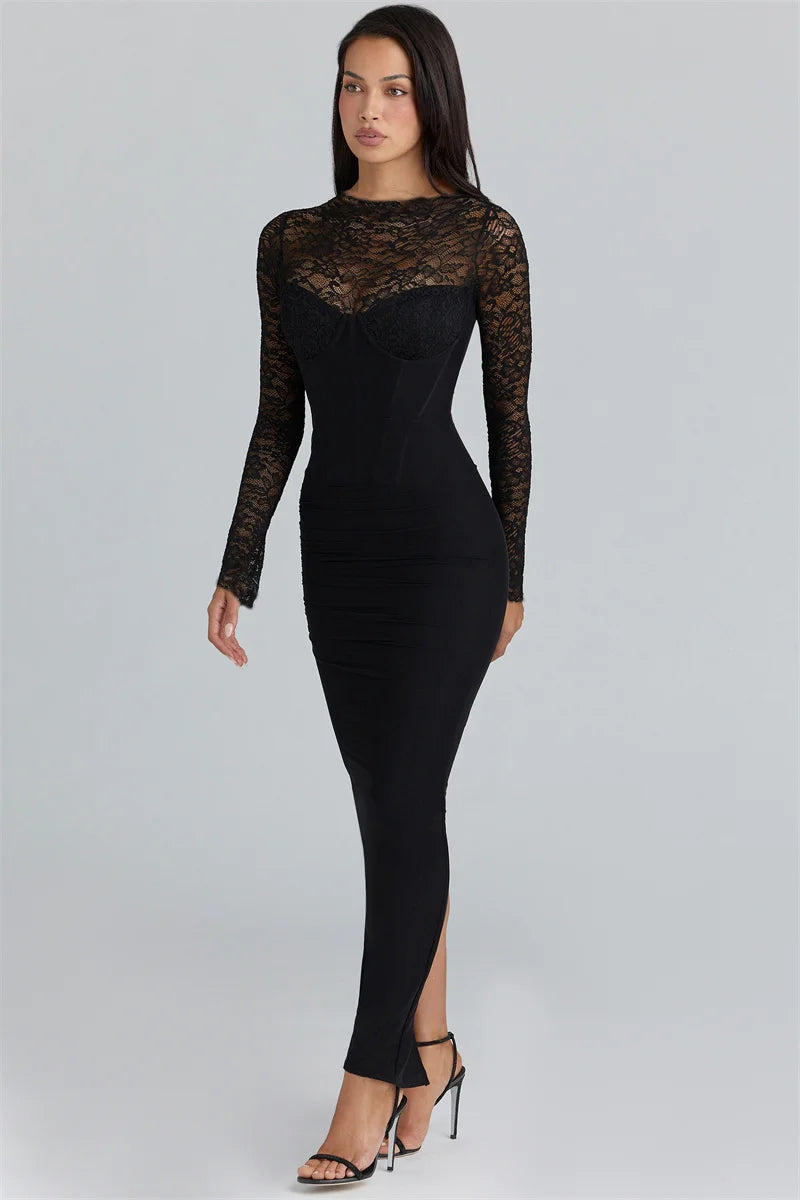 Woman wearing a black dress with lace sleeves on a gray background