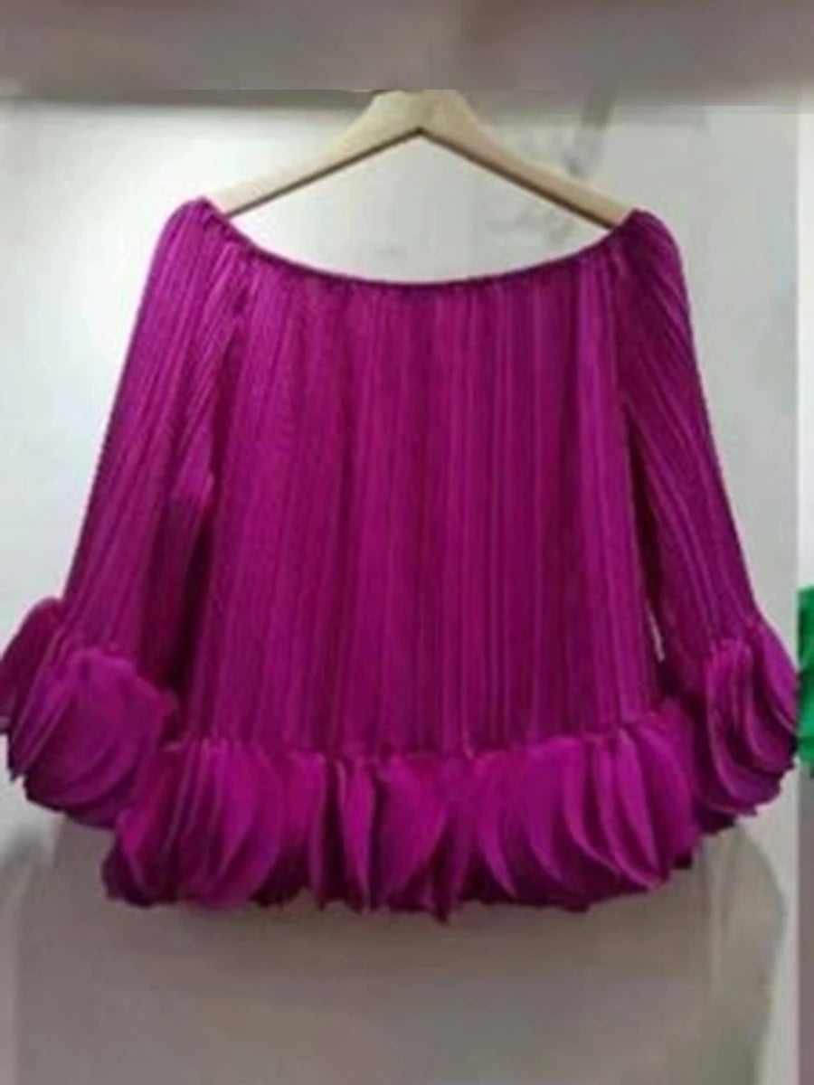 Purple pleated off-shoulder blouse on hanger