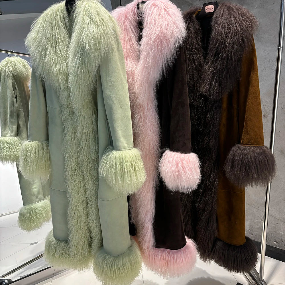 Four fur coats in different colors hanging on a rack.