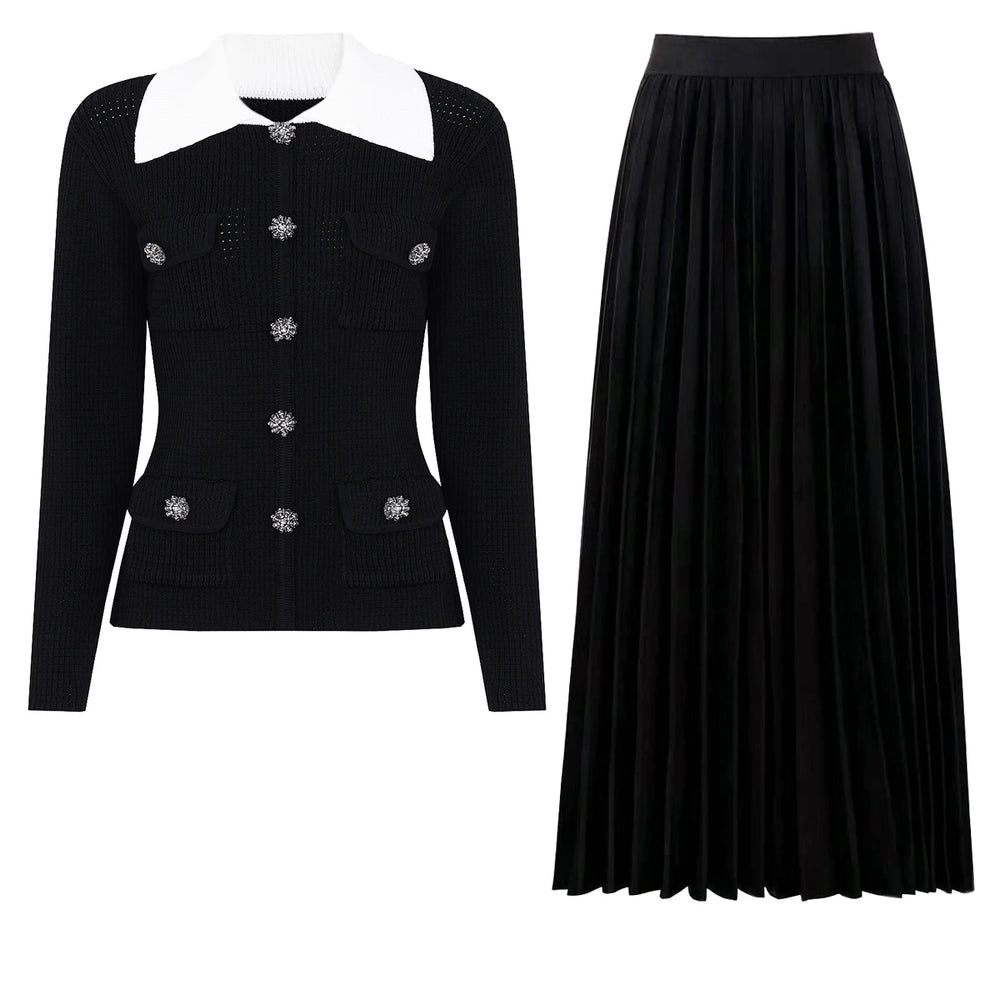 Black knit cardigan with white collar and jeweled buttons paired with a black pleated midi skirt.