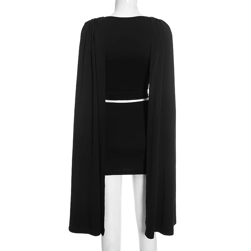 Black dress with long sleeves on a mannequin against a white background