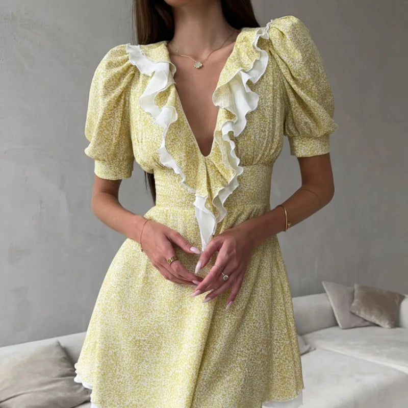 Close-up of floral ruffle v-neck puff sleeve mini dress