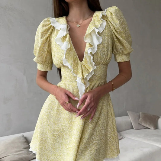 Close-up of floral ruffle v-neck puff sleeve mini dress