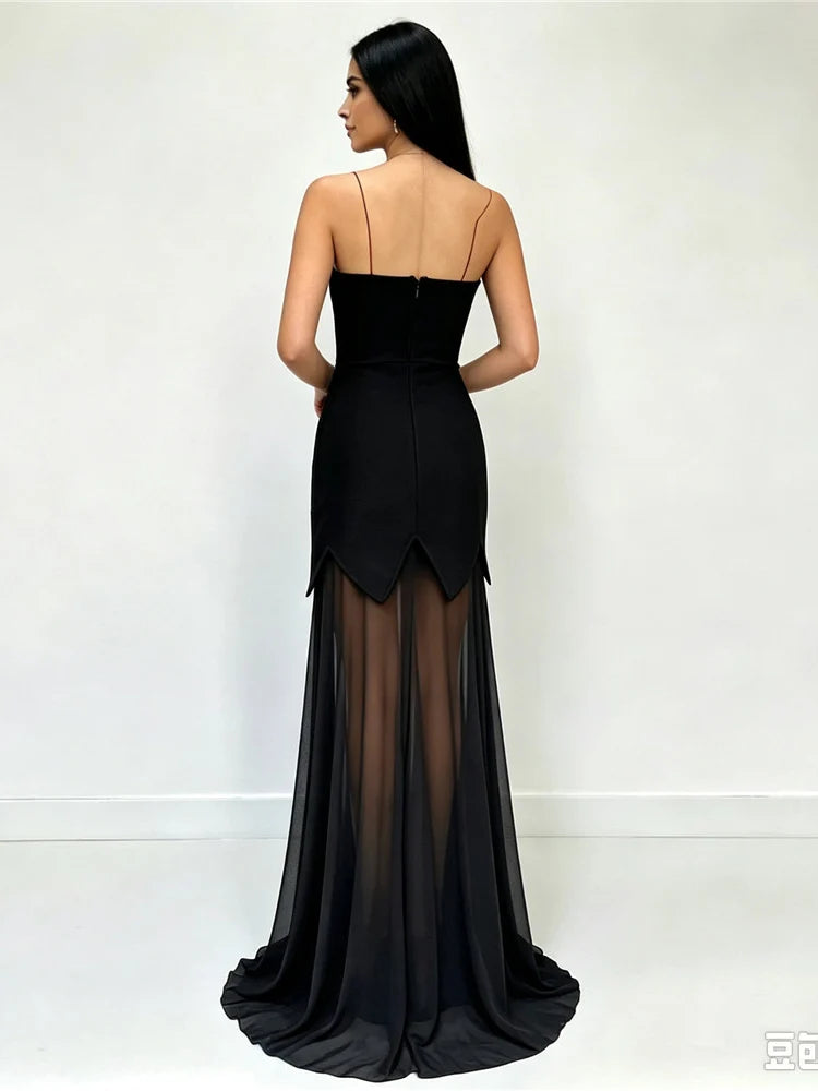 Back view of black strapless top and maxi skirt two-piece set