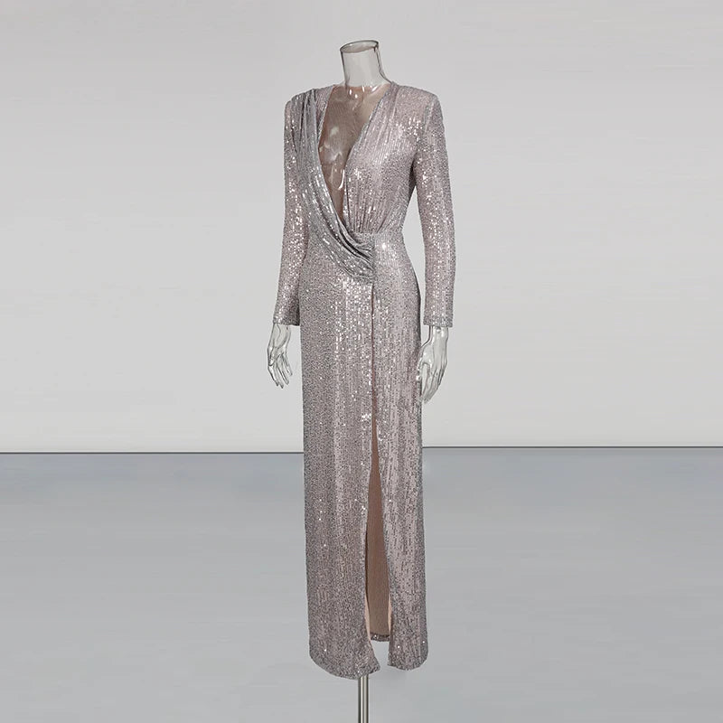 Silver sequin evening gown on a mannequin against a plain background
