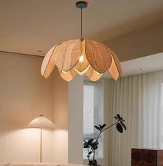 Bohemian rattan petal pendant light with handwoven wicker shade hanging from ceiling
