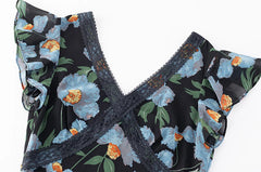 Close-up of lace trim and V-neckline on floral print maxi dress