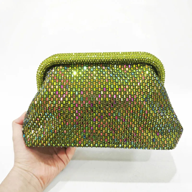 Hand holding a lime green crystal-embellished clutch bag