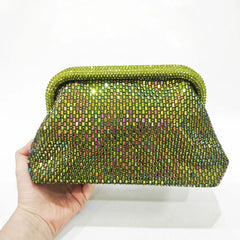Hand holding a lime green crystal-embellished clutch bag