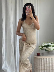 Sleeveless rhinestone deep-V backless maxi dress.

