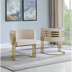 Beige chairs with gold frames in a room with abstract art on the wall.
