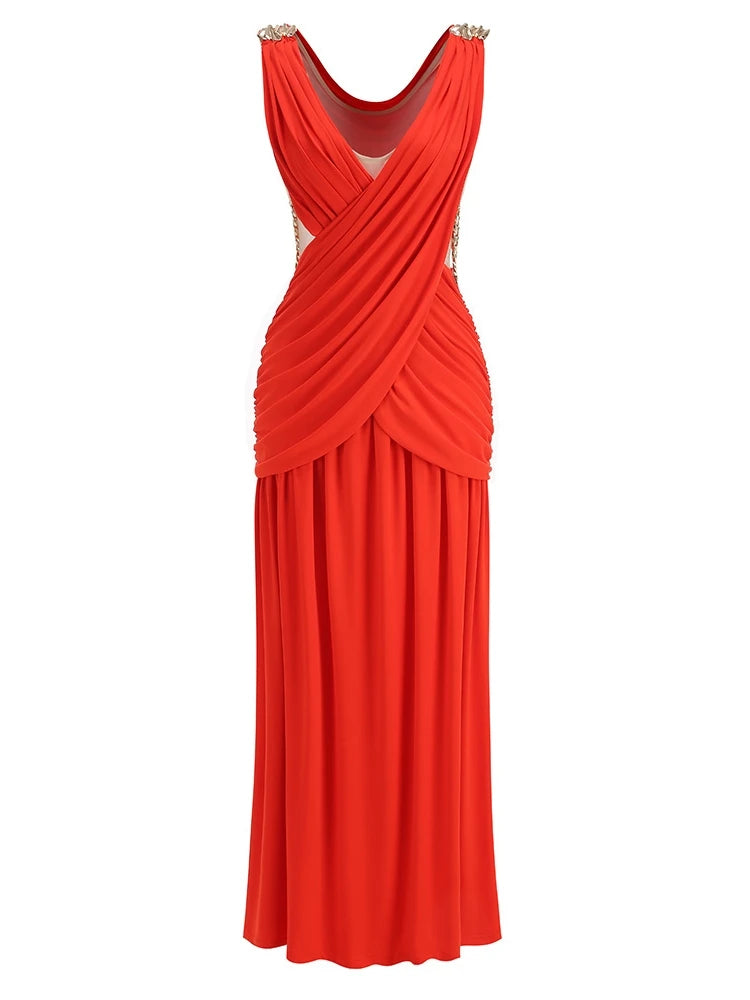 Red evening gown with gold embellishments on a white background