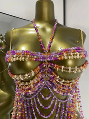 Close-up of a beaded body jewelry swimwear top with intricate beadwork.