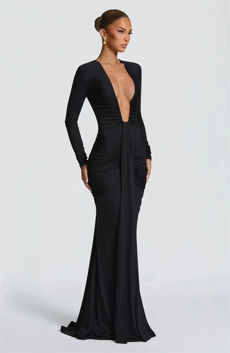 Black evening gown with a plunging neckline on a white background