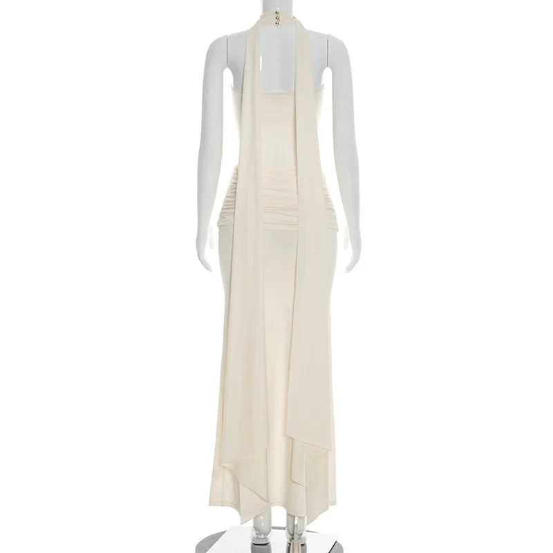 Mannequin wearing a cream-colored dress on a white background