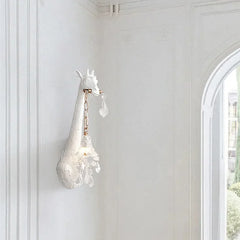 A cute giraffe-shaped wall lamp with a warm LED light, adding a playful touch to a child's bedroom Golden Atelier 3