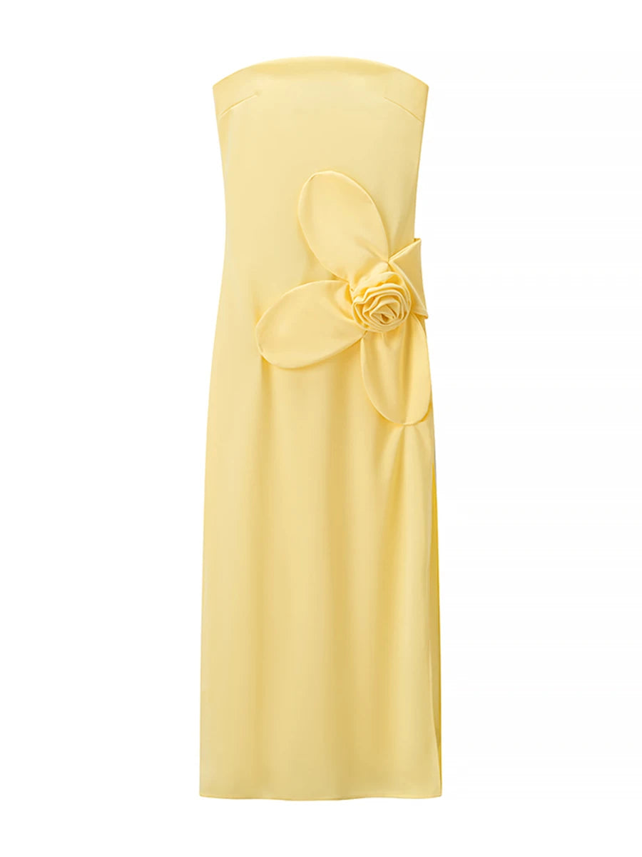 Yellow strapless dress with a floral detail on a white background