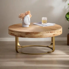 Wooden coffee table with gold legs in a room setting