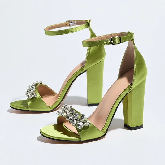 Pair of green satin ankle strap sandals with crystal embellishments