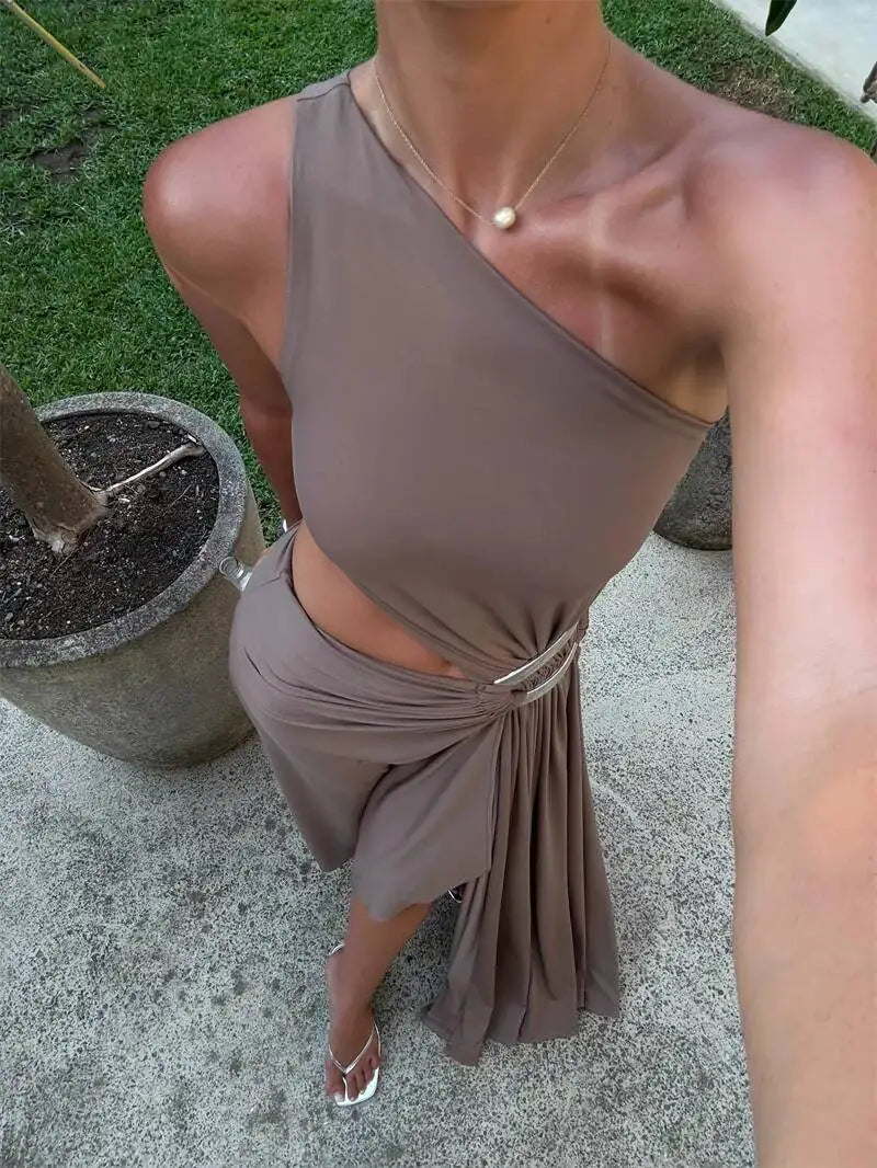 Close-up of a one shoulder cutout maxi dress neckline and waist