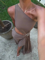 Close-up of a one shoulder cutout maxi dress neckline and waist