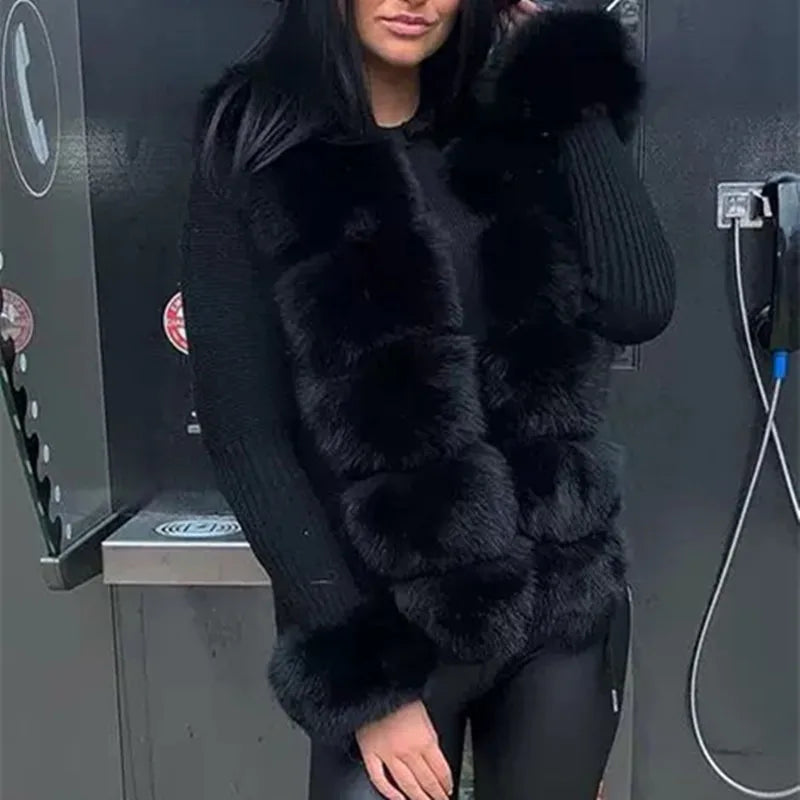 Person wearing a black fur coat standing next to a vehicle charging station.
