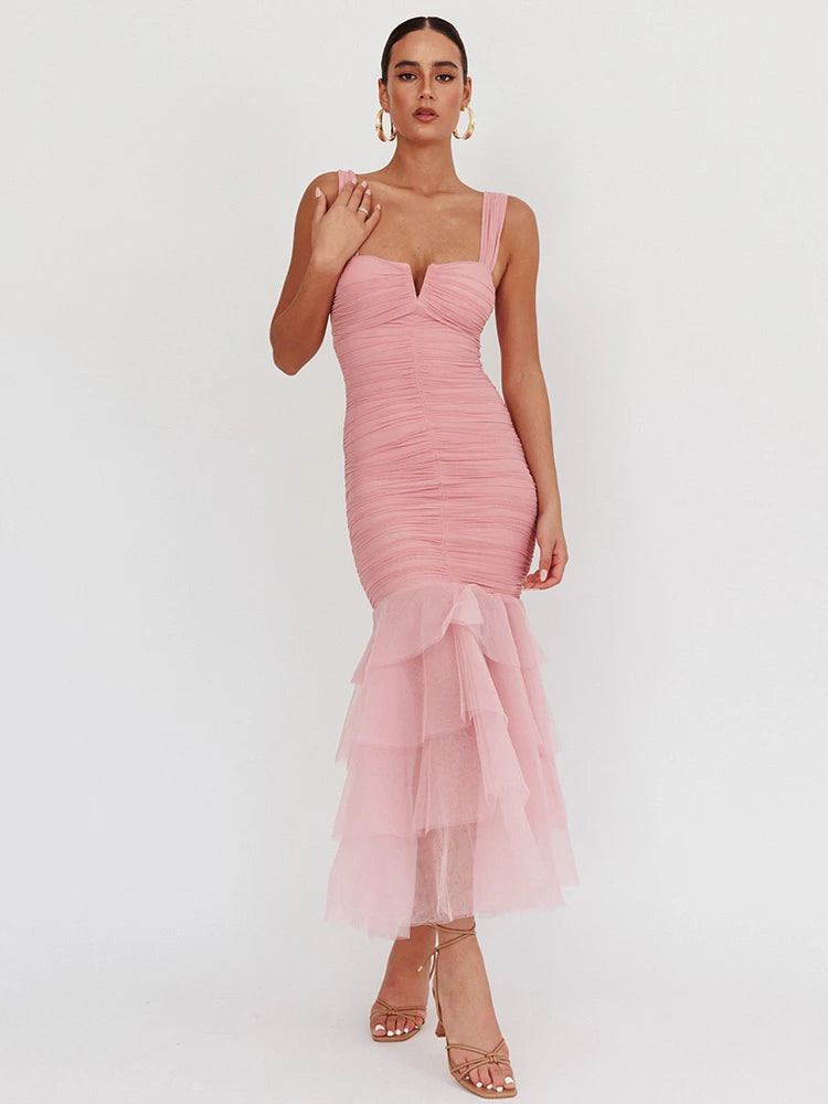 Pink dress with sheer overlay on a white background