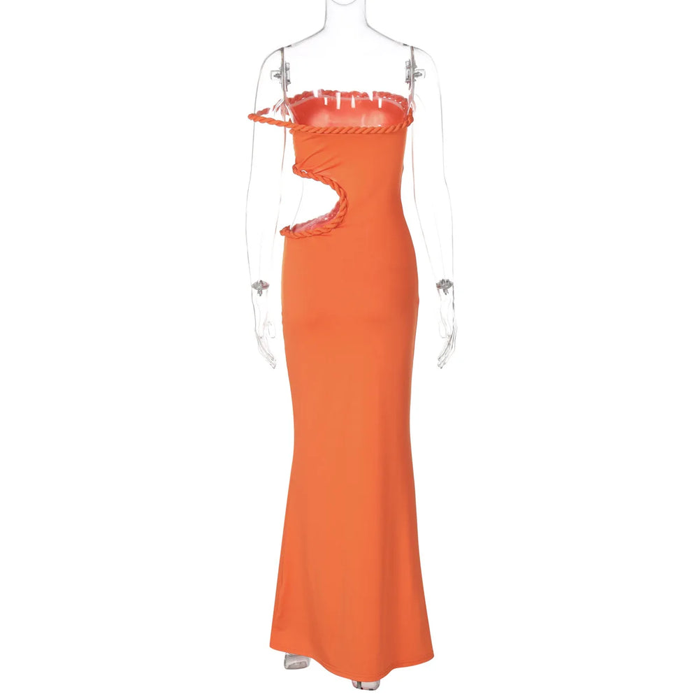Orange evening gown on a mannequin against a white background