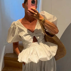 White puff sleeve top with bow detail and cutout, front view