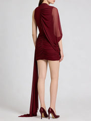 Maroon evening gown with a draped design on a white background