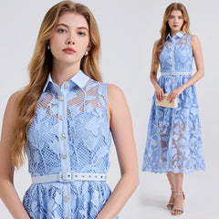 Woman wearing a blue lace dress with a white background