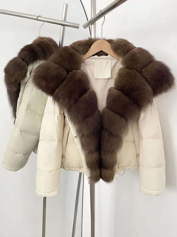 White puffer jacket with brown fur trim on a hanger against a white background