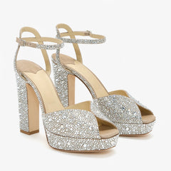 Silver crystal embellished platform sandals with a chunky block heel and ankle strap.