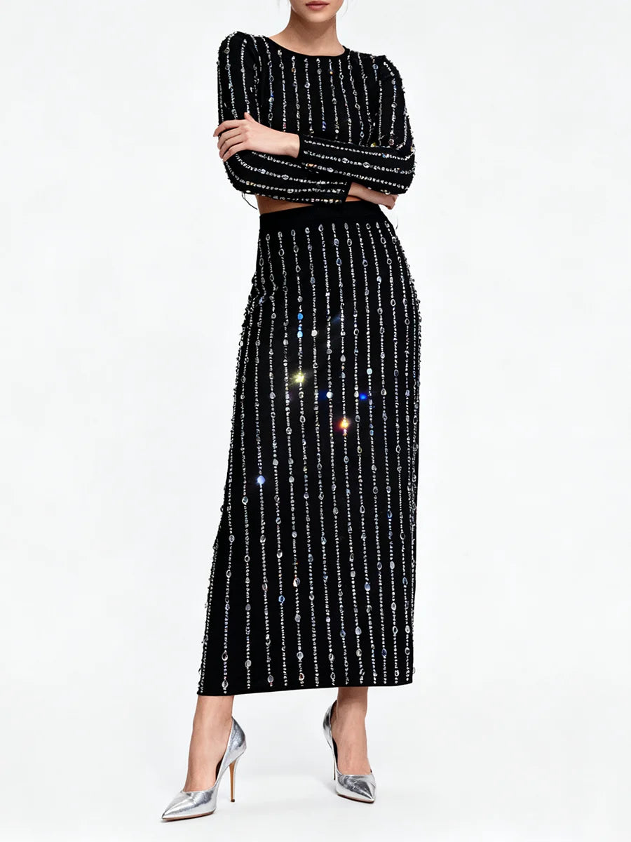 Black outfit with sequin details on a white background