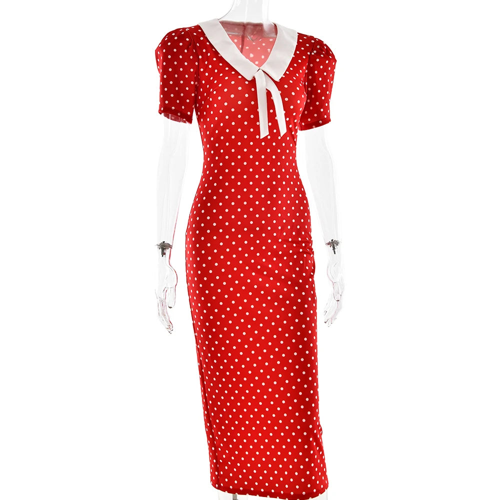 Red polka dot dress with white collar on a mannequin against a white background