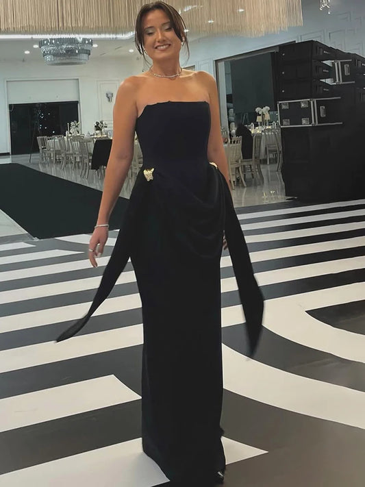 Black strapless draped maxi dress with long sash details