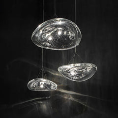  Close-up detail of the unique manta ray-shaped glass shade and sleek metal accents on the pendant light. Golden Atelier 4